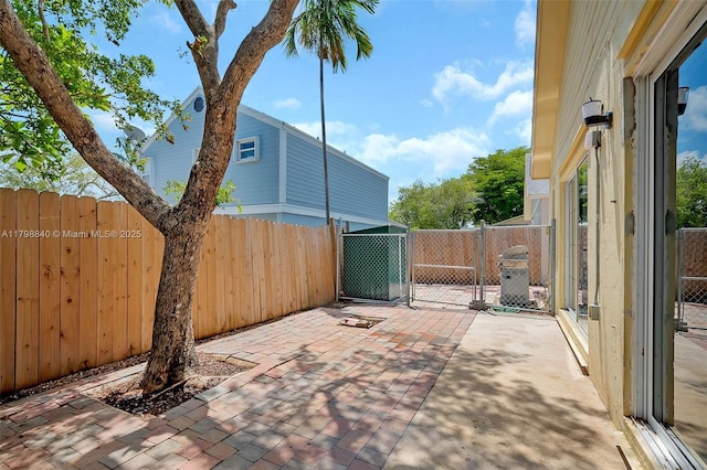 view of patio / terrace with a fenced backyard and a gate