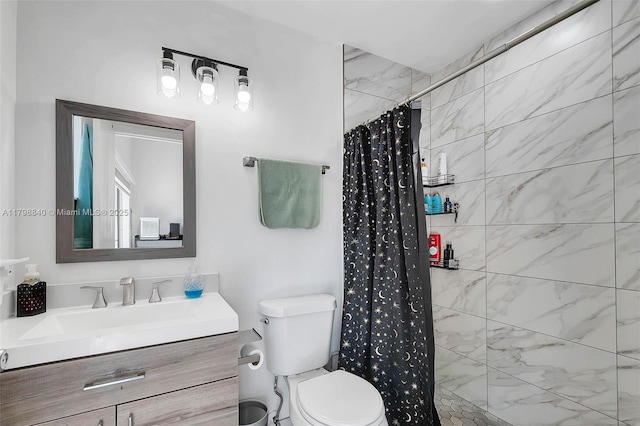 full bath with a tile shower, toilet, and vanity