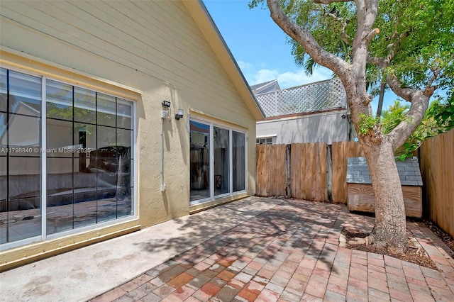 view of patio featuring fence