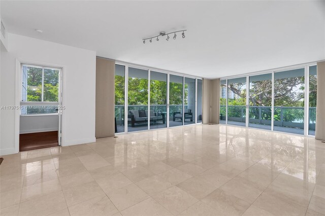 tiled empty room with expansive windows