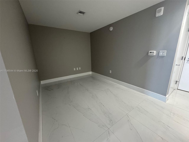 16385 Biscayne Blvd Unit 1806, North Miami Beach, FL 33160 - unfurnished room featuring light marble finish floors and baseboards