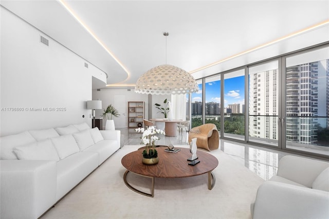 living area with a city view and expansive windows
