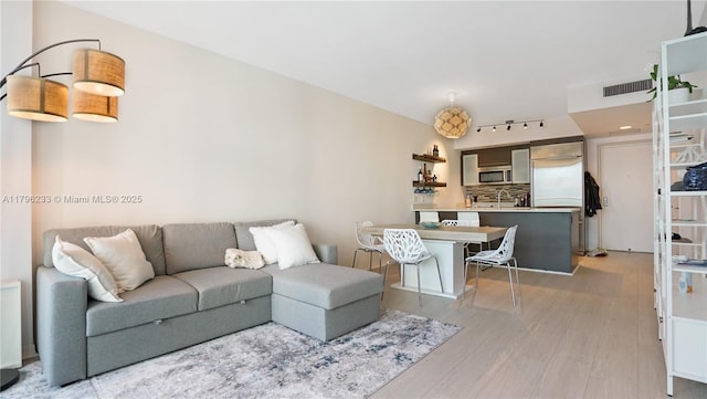 living area featuring light wood-style floors