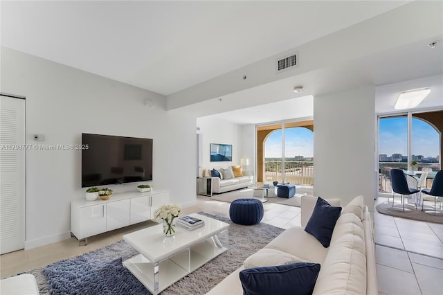 2425 SW 27th Ave Unit 1408, Miami, FL 33145 - living room with light tile patterned floors and baseboards