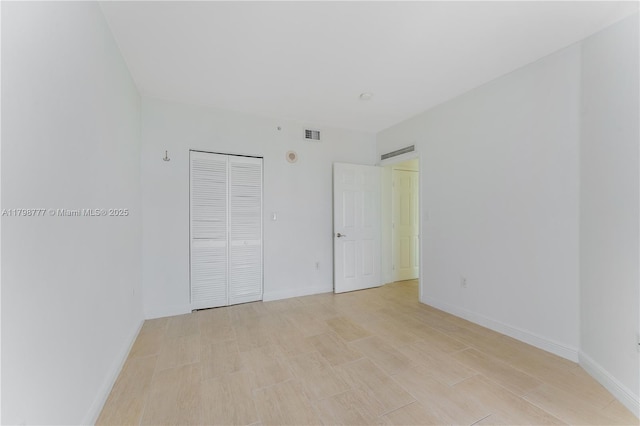 2425 SW 27th Ave Unit 1408, Miami, FL 33145 - unfurnished bedroom featuring baseboards and a closet