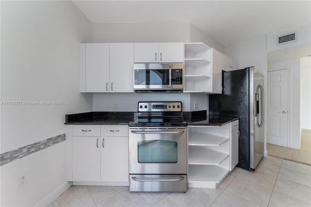 2425 SW 27th Ave Unit 1408, Miami, FL 33145 - kitchen with open shelves, appliances with stainless steel finishes, white cabinets, and dark stone countertops