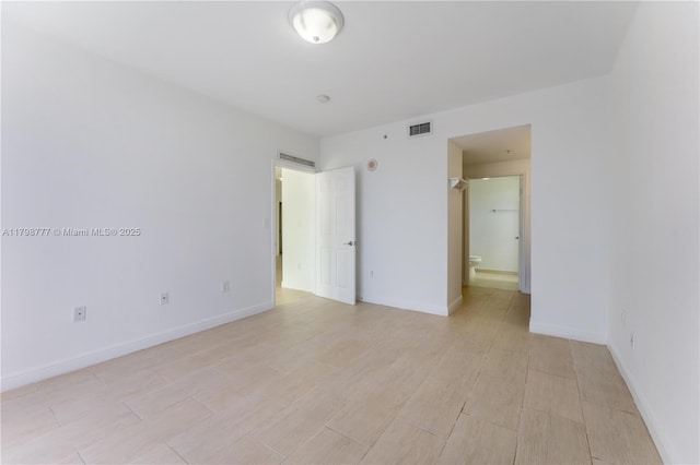 2425 SW 27th Ave Unit 1408, Miami, FL 33145 - unfurnished bedroom with baseboards and light wood-type flooring