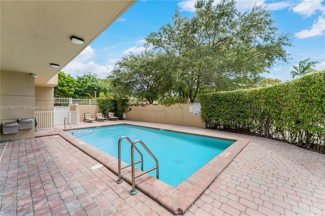 2425 SW 27th Ave Unit 1408, Miami, FL 33145 - community pool with a fenced backyard and a patio area