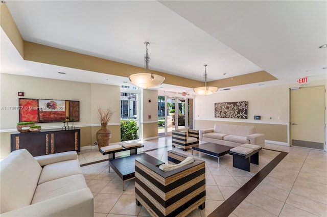 2425 SW 27th Ave Unit 1408, Miami, FL 33145 - living area with light tile patterned floors, baseboards, and a raised ceiling
