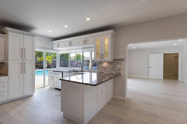 11210 SW 181st St, Miami, FL 33157 - kitchen with dishwasher, a sink, dark stone countertops, backsplash, and recessed lighting