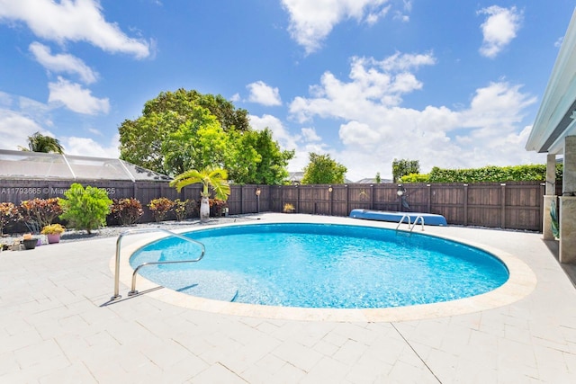11210 SW 181st St, Miami, FL 33157 - view of swimming pool featuring a fenced backyard and a patio