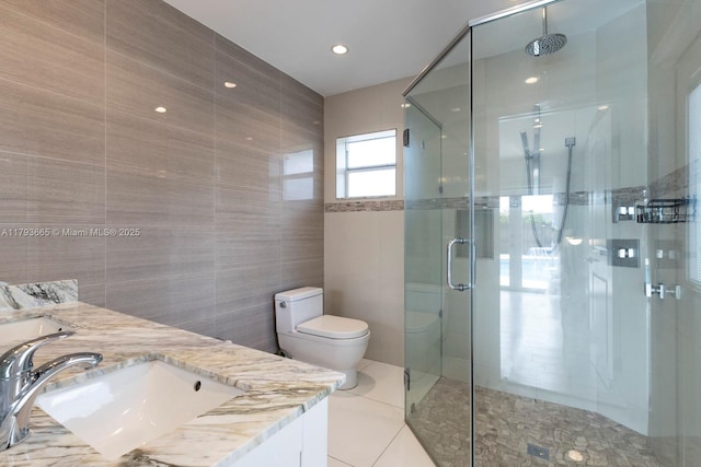 11210 SW 181st St, Miami, FL 33157 - full bath featuring tile walls, a shower stall, toilet, double vanity, and tile patterned floors