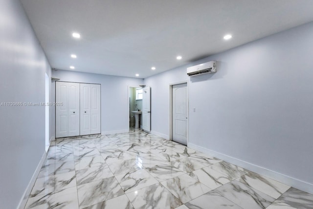 11210 SW 181st St, Miami, FL 33157 - unfurnished room with an AC wall unit, recessed lighting, baseboards, light marble finish flooring, and a sink