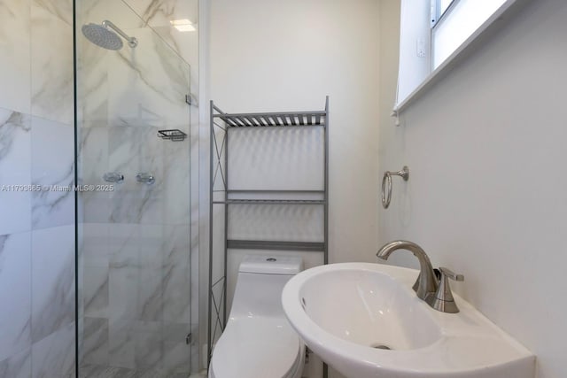 11210 SW 181st St, Miami, FL 33157 - bathroom featuring a sink, a marble finish shower, and toilet
