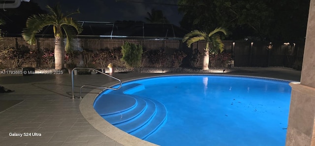11210 SW 181st St, Miami, FL 33157 - pool at twilight featuring a fenced backyard and a patio