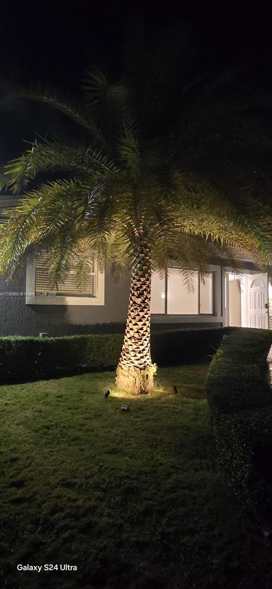 11210 SW 181st St, Miami, FL 33157 - property exterior at night featuring stucco siding