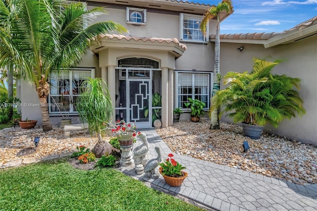 12672 Tucano Cir, Boca Raton, FL 33428 - property entrance with stucco siding and a tiled roof
