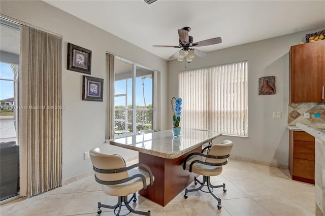 12672 Tucano Cir, Boca Raton, FL 33428 - dining space with a ceiling fan, baseboards, and light tile patterned floors