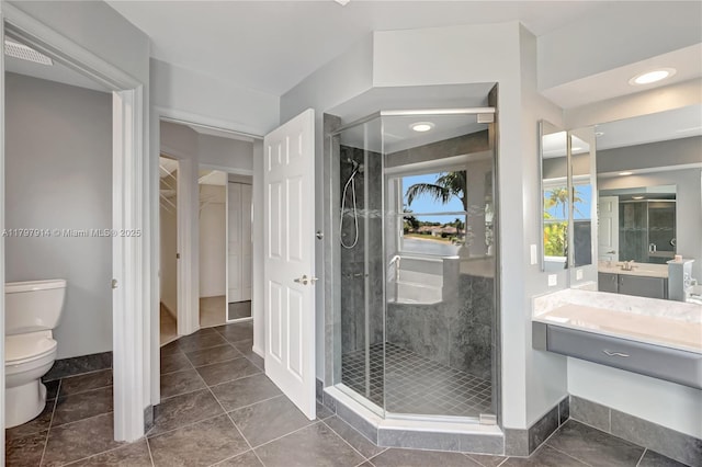 12672 Tucano Cir, Boca Raton, FL 33428 - full bath with a stall shower, toilet, vanity, baseboards, and tile patterned flooring