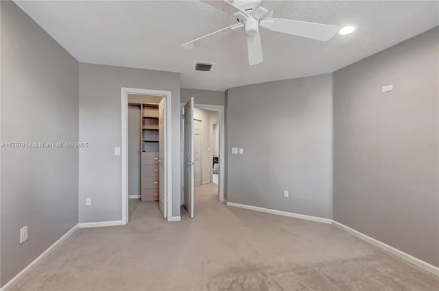 12672 Tucano Cir, Boca Raton, FL 33428 - unfurnished bedroom featuring carpet floors, a walk in closet, baseboards, ceiling fan, and a closet