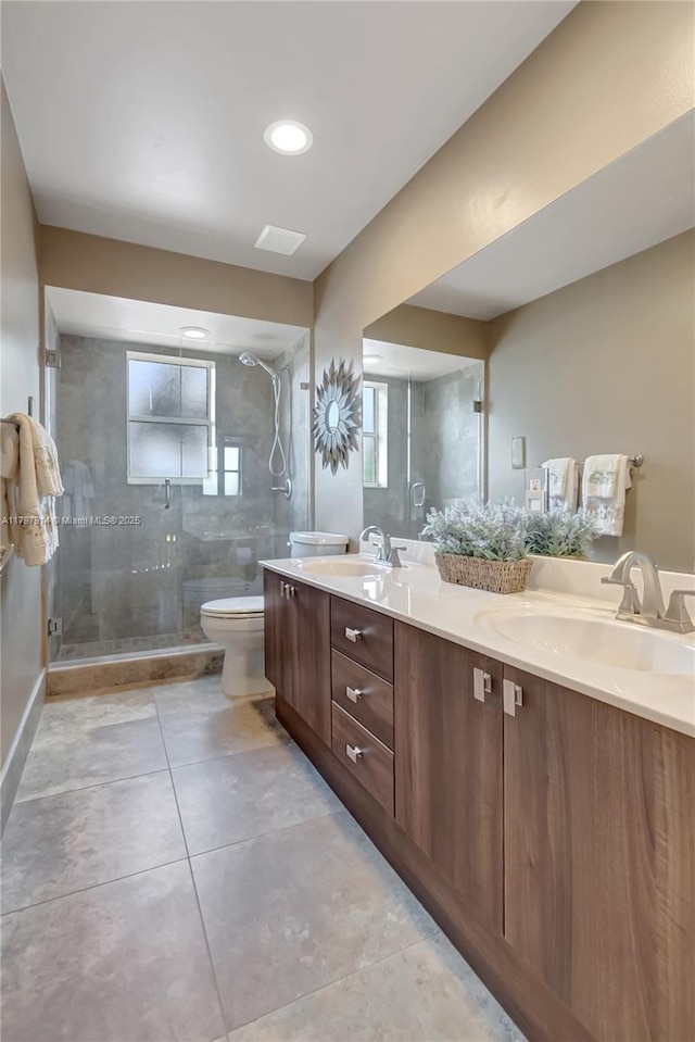 12672 Tucano Cir, Boca Raton, FL 33428 - bathroom with toilet, a stall shower, double vanity, and tile patterned flooring
