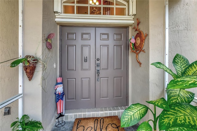 12672 Tucano Cir, Boca Raton, FL 33428 - doorway to property with stucco siding