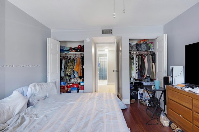 4848 NW 24th Ct Unit 215, Lauderdale Lakes, FL 33313 - bedroom with wood finished floors and two closets
