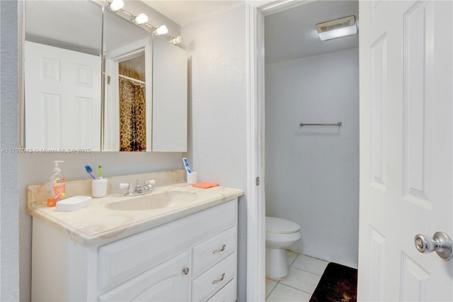 4848 NW 24th Ct Unit 215, Lauderdale Lakes, FL 33313 - full bathroom featuring tile patterned floors, toilet, and vanity