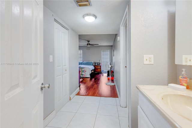 4848 NW 24th Ct Unit 215, Lauderdale Lakes, FL 33313 - bathroom featuring tile patterned flooring, a ceiling fan, and vanity
