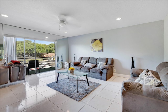 4848 NW 24th Ct Unit 215, Lauderdale Lakes, FL 33313 - living area featuring ceiling fan, light tile patterned flooring, recessed lighting, and baseboards