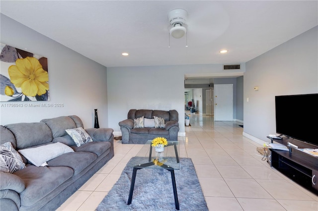 4848 NW 24th Ct Unit 215, Lauderdale Lakes, FL 33313 - living room with light tile patterned floors, ceiling fan, baseboards, and recessed lighting