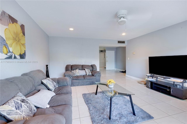 4848 NW 24th Ct Unit 215, Lauderdale Lakes, FL 33313 - living area featuring light tile patterned floors, a ceiling fan, recessed lighting, and baseboards
