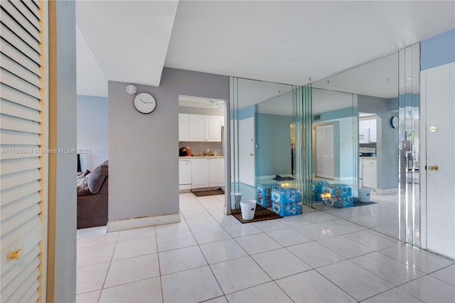4848 NW 24th Ct Unit 215, Lauderdale Lakes, FL 33313 - bathroom featuring tile patterned floors and baseboards