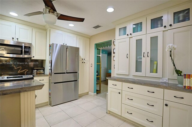 10610 SW 103rd St, Miami, FL 33176 - kitchen with stainless steel appliances, a ceiling fan, recessed lighting, light tile patterned floors, and decorative backsplash