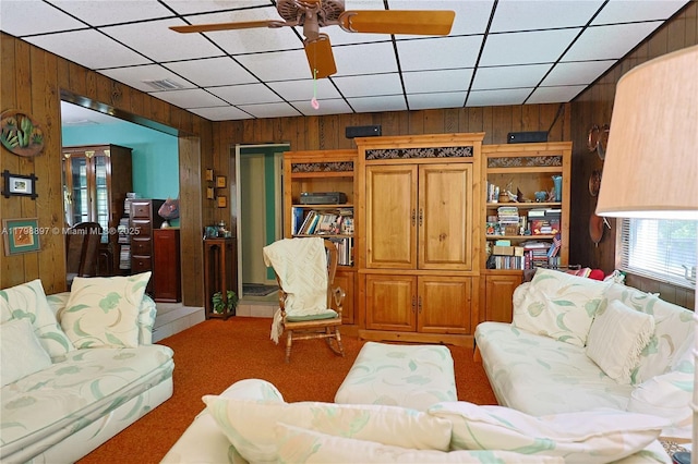 10610 SW 103rd St, Miami, FL 33176 - carpeted living room featuring wooden walls and ceiling fan
