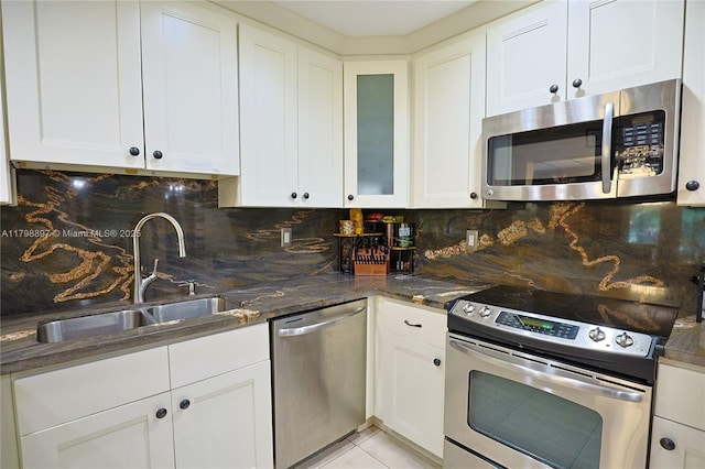 10610 SW 103rd St, Miami, FL 33176 - kitchen with appliances with stainless steel finishes, a sink, decorative backsplash, and white cabinets