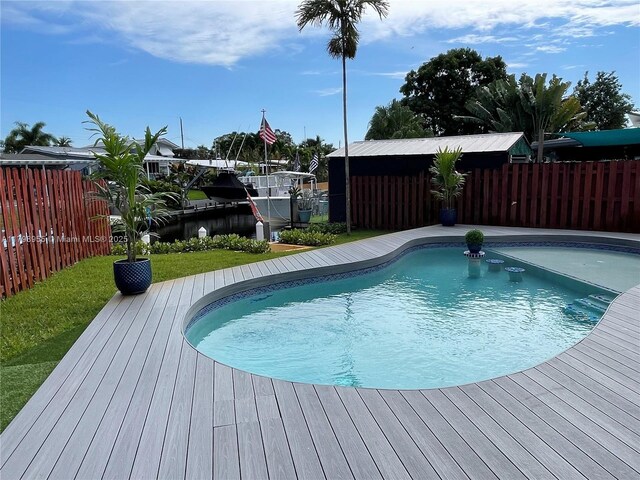 2406 Marathon Ln, Fort Lauderdale, FL 33312 - view of swimming pool with fence and a boat dock