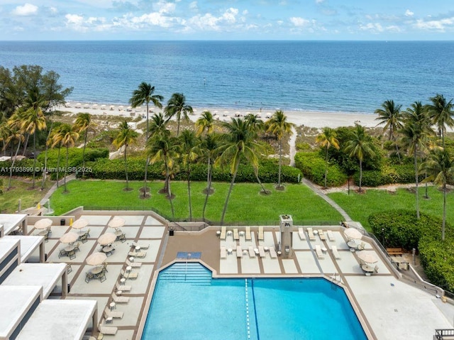 151 Crandon Blvd Unit 926, Key Biscayne, FL 33149 - community pool with view of water and beach, a lawn, and a patio