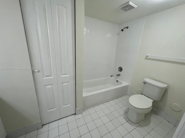 full bathroom featuring toilet, tile patterned floors,  shower combination, and baseboards