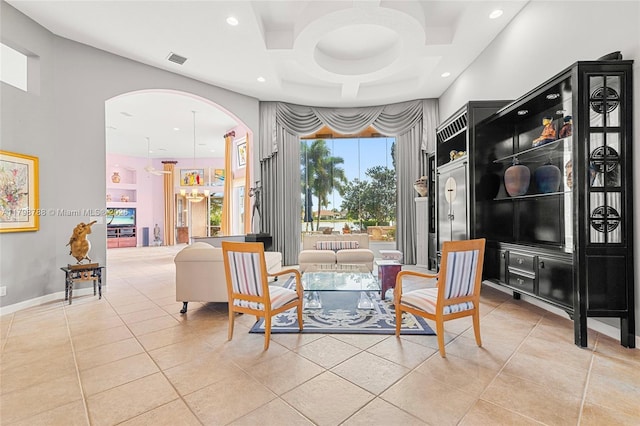 8100 Muirhead Cir, Boynton Beach, FL 33472 - living area with arched walkways, coffered ceiling, light tile patterned floors, and recessed lighting