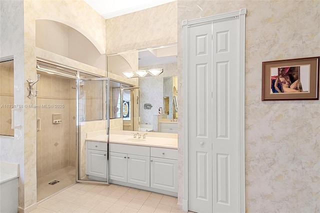 8100 Muirhead Cir, Boynton Beach, FL 33472 - full bath featuring a closet, tile patterned floors, vanity, a shower stall, and wallpapered walls