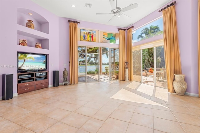 8100 Muirhead Cir, Boynton Beach, FL 33472 - unfurnished living room with ceiling fan, light tile patterned floors, built in features, and recessed lighting