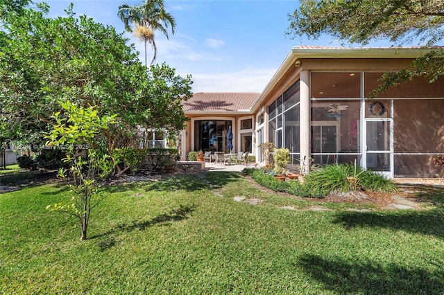 8100 Muirhead Cir, Boynton Beach, FL 33472 - view of grassy yard with a sunroom and a patio