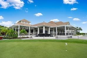 8100 Muirhead Cir, Boynton Beach, FL 33472 - rear view of house featuring a putting area