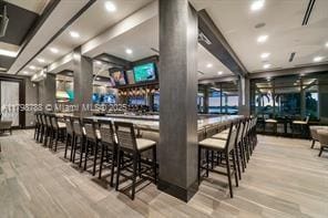 8100 Muirhead Cir, Boynton Beach, FL 33472 - community bar area with wood finished floors and decorative columns