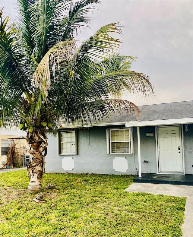 8130 SW 7th Ct, North Lauderdale, FL 33068 - view of front of home featuring stucco siding and a front lawn