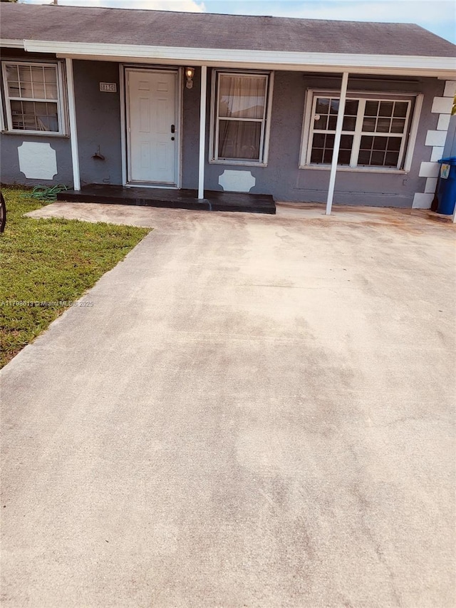 8130 SW 7th Ct, North Lauderdale, FL 33068 - view of front of property with stucco siding and a shingled roof