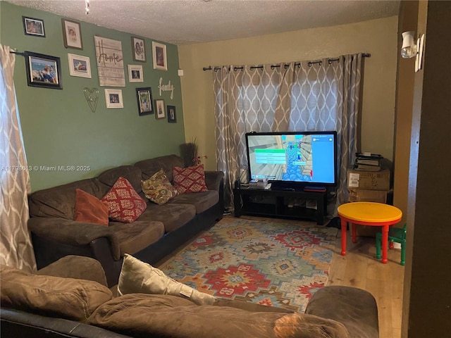 8130 SW 7th Ct, North Lauderdale, FL 33068 - living area with wood finished floors and a textured ceiling