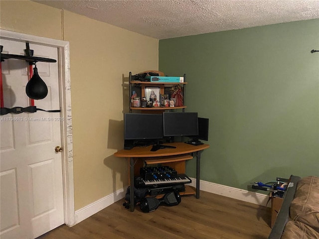8130 SW 7th Ct, North Lauderdale, FL 33068 - office featuring wood finished floors, a textured ceiling, and baseboards