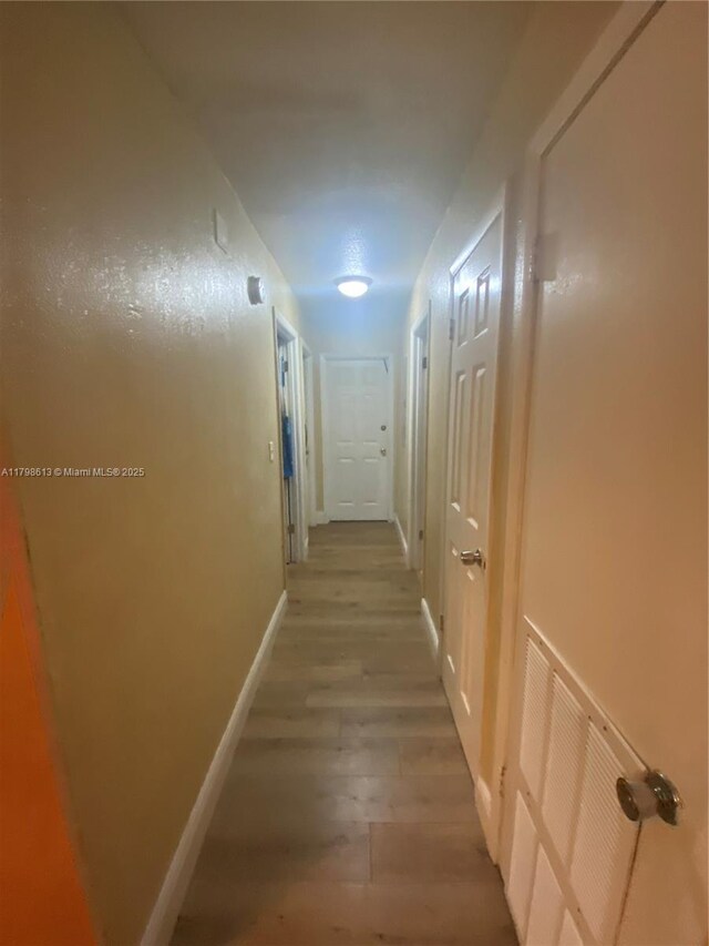 8130 SW 7th Ct, North Lauderdale, FL 33068 - hall featuring light wood finished floors and baseboards